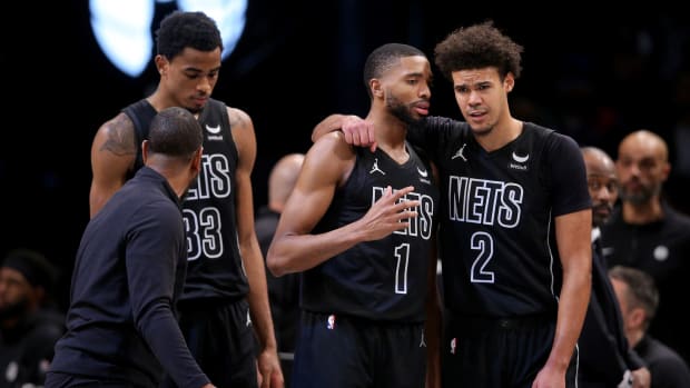 Brooklyn Nets forward Mikal Bridges (1) talks to forward Cameron Johnson (2) during the fourth quarter against the Portland Trail Blazers